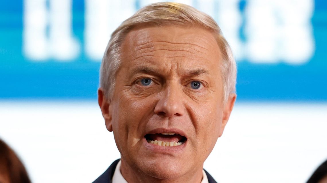 Chile's presidential candidate Jose Antonio Kast of the Republican party, gestures as he speaks to the press after a debate organized by Channel 13 Television in Santiago on October 26, 2025.