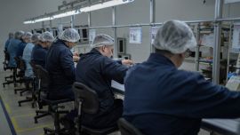 Worker assemble air conditioner parts at Electra-Aires del Sur Electra factory in Rio Grande, Tierra del Fuego Province.