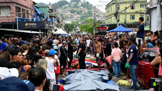 Bodies lined up in Rio favela - STOCK