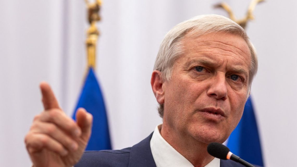 Chile's presidential candidate Jose Antonio Kast of the Republican Party speaks about his proposals on border protection and measures against illegal immigration during a press conference at his campaign headquarters in Santiago, on October 29, 2025.