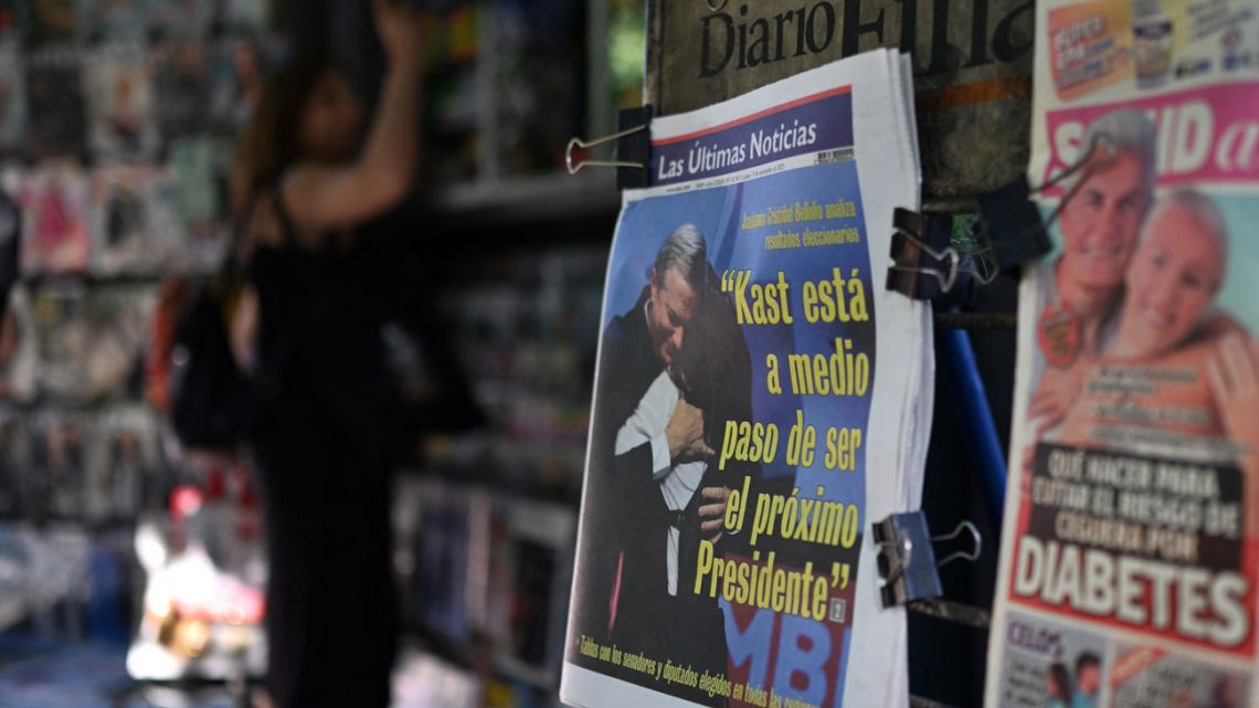 The front page of a newspaper reading 'Kast is halfway to becoming the next president' is seen at a kiosk in the commune of Providencia, in Santiago, on November 17, 2025.