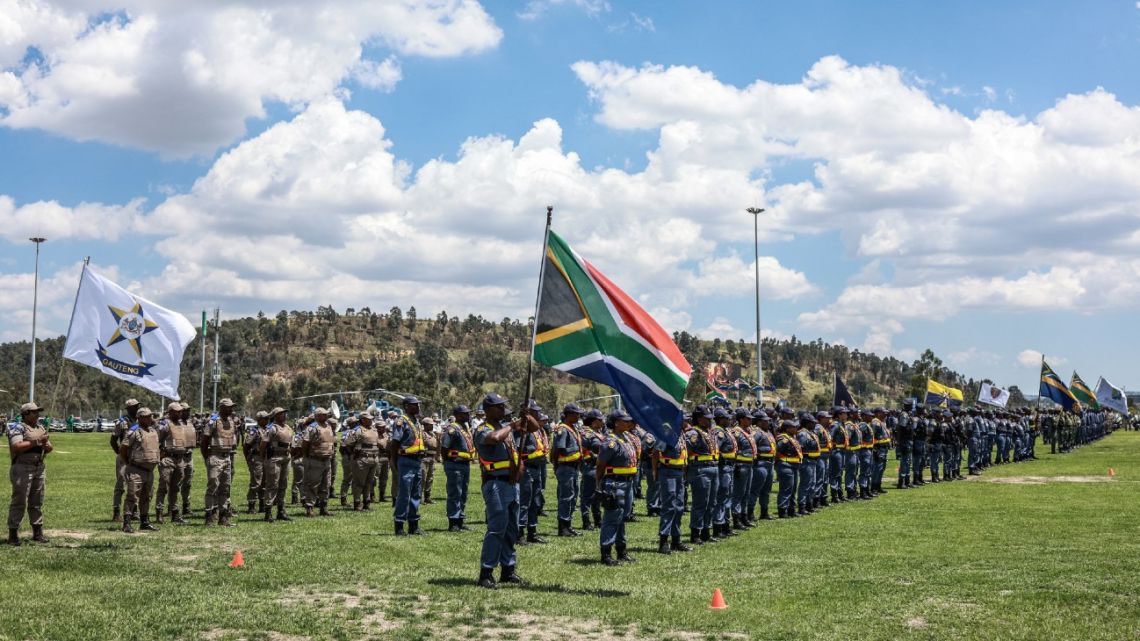 Members of the South African Police Service (SAPS) stand at attention during the Integrated Law Enforcement parade near the Nasrec Expo Centre in Johannesburg, on November 19, 2025. The parade forms part of the Justice, Crime Prevention and Security Cluster's comprehensive state of readiness operations for the G20 Summit. 