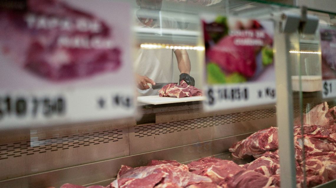 A worker prepares a cut of beef for a customer at a butcher shop in Rosario, Argentina, on Wednesday, August 27, 2025.