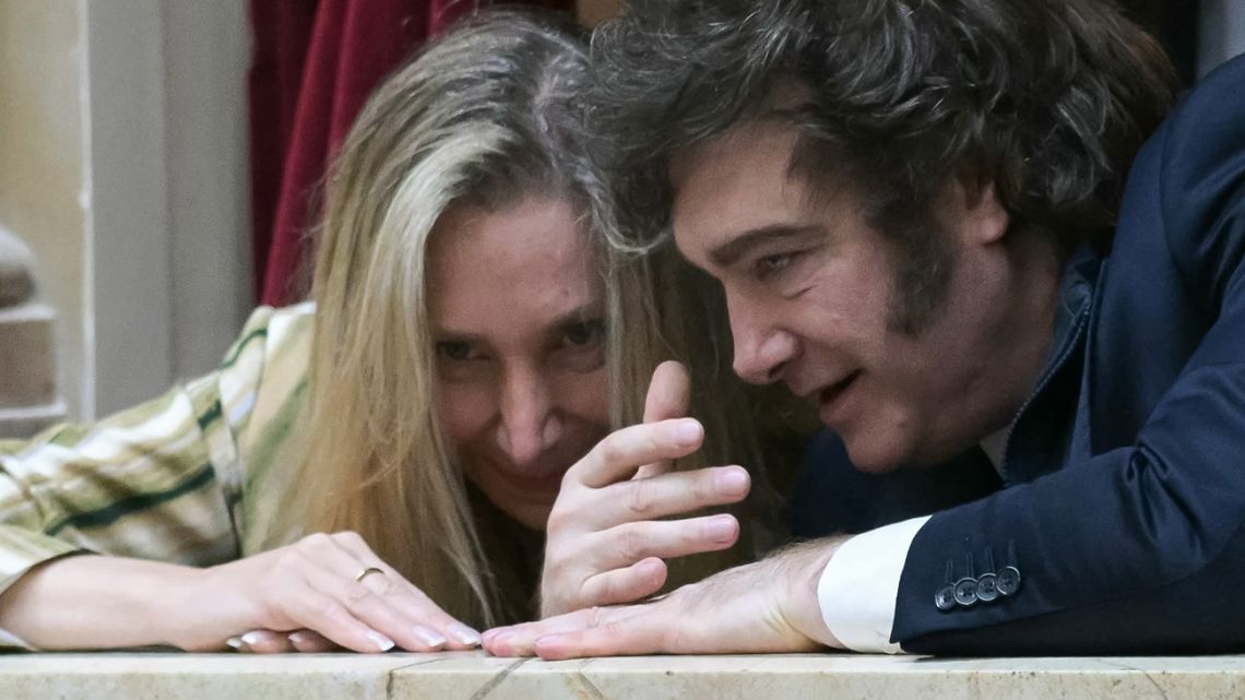 Argentina’s President Javier Milei speaks with Presidential Chief-of-Staff Karina Milei as they attend the oath ceremony at the Chamber of Deputies at Congress on December 3, 2025. 