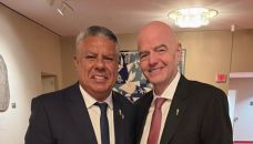 Claudio Fabián Tapia junto a Gianni Infantino