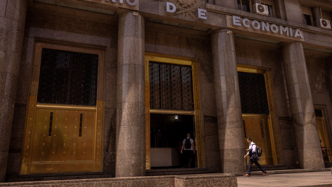 A worker walks into the Economy Ministry building in Buenos Aires on December 10, 2025.