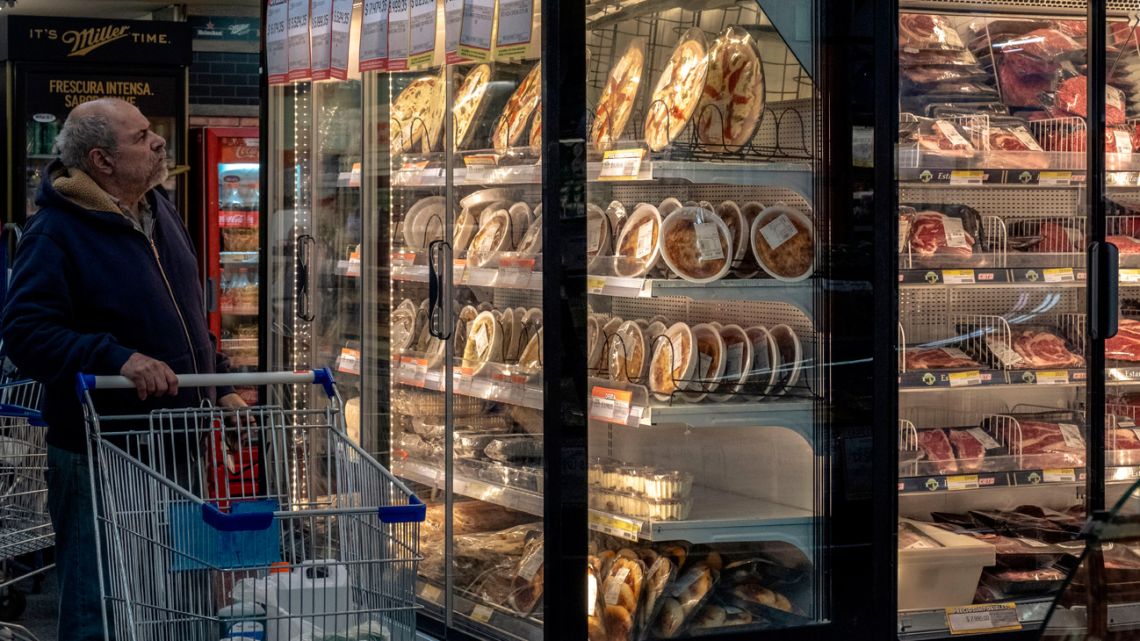 A shopper browses products at a grocery store in Buenos Aires.