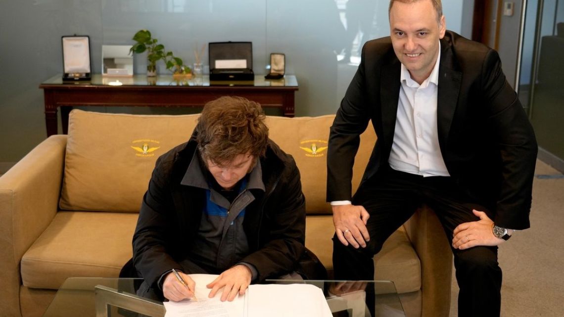 President Javier Milei signs the text of his labour reform bill, which was sent to Congress on Thursday.