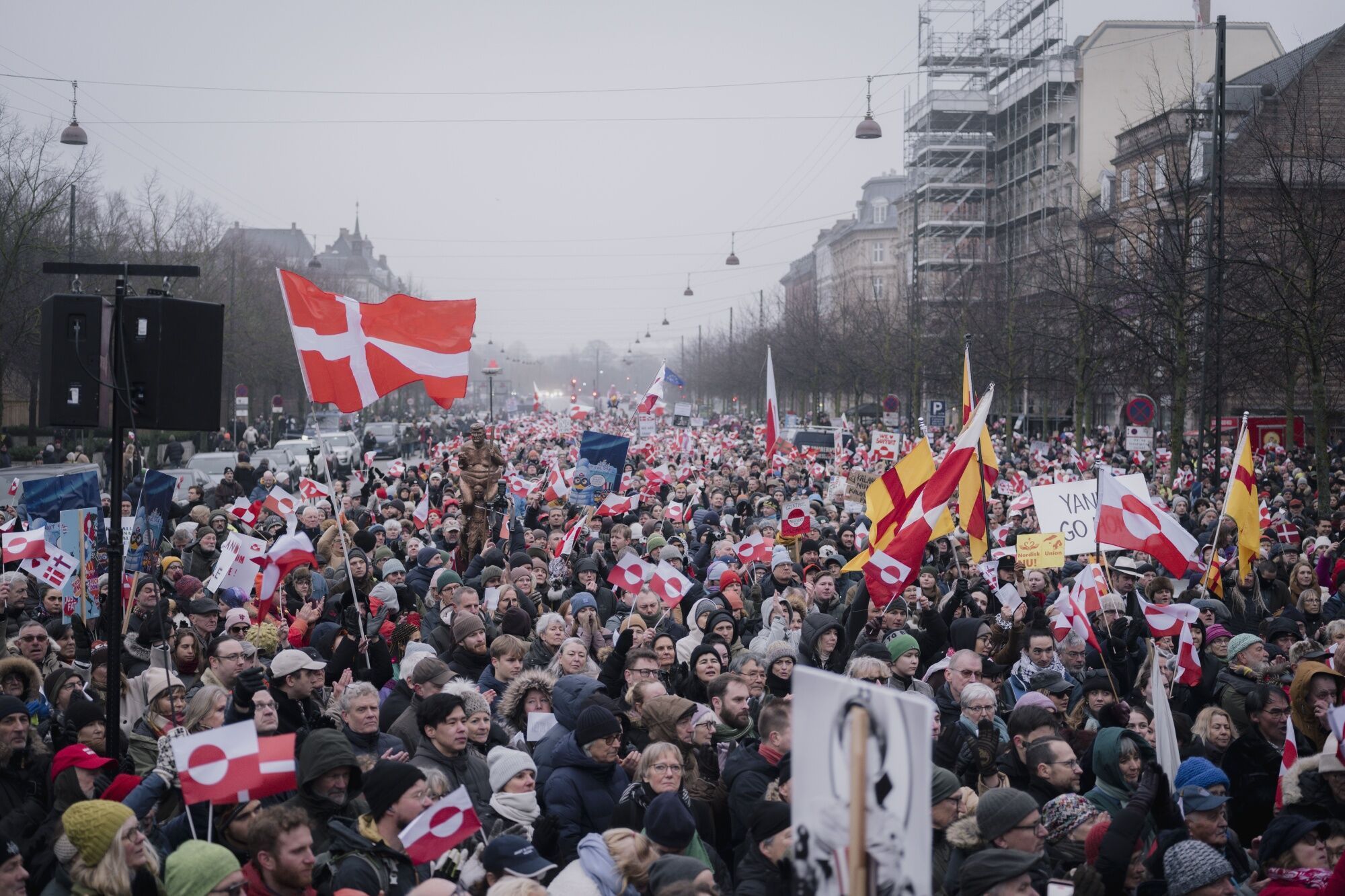 Protesters with Danish and Greenlandic flags during a demonstration in Copenhagen, on Jan. 17.