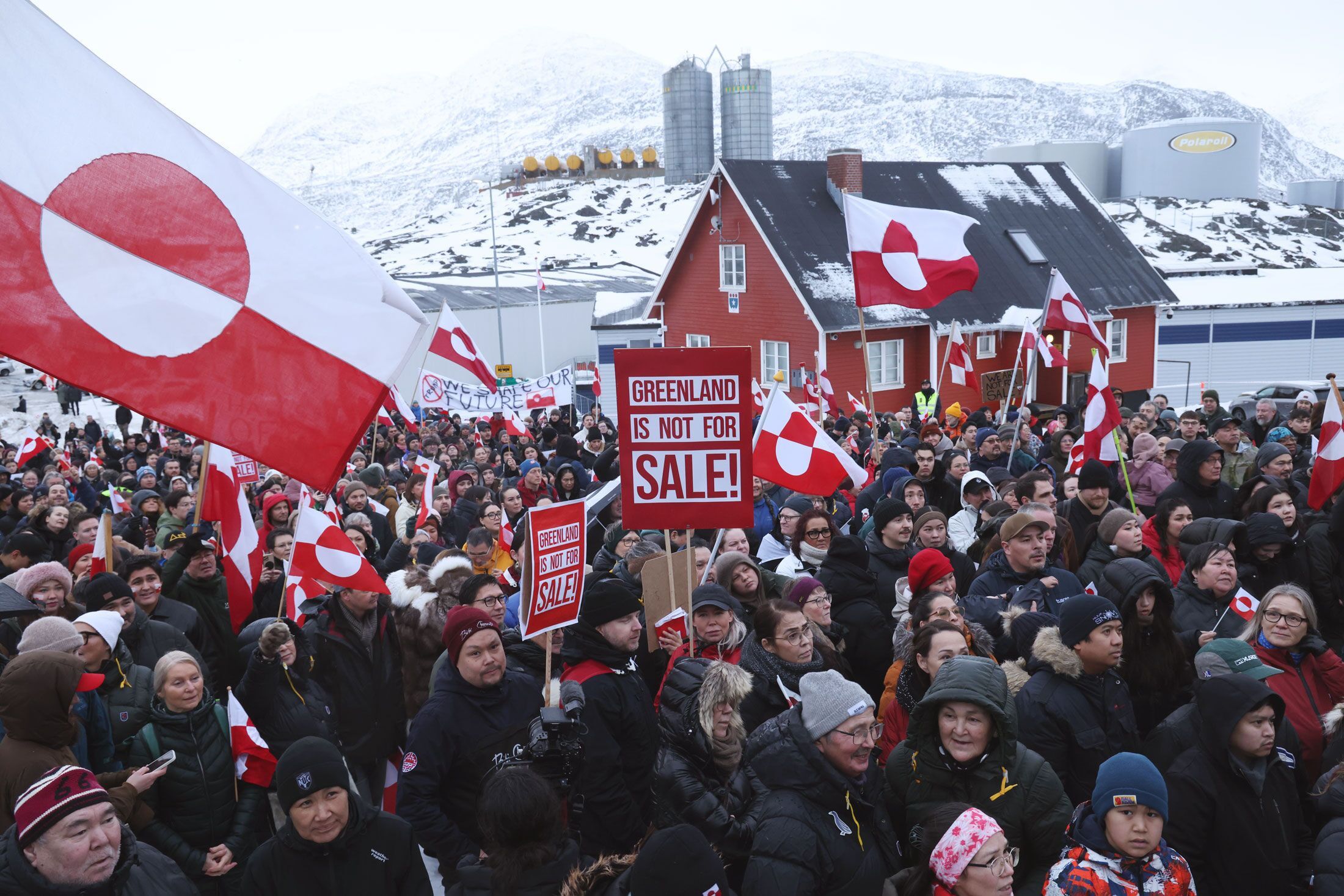 Protesters hold Greenlandic flags and placards outside the US consulate in Nuuk, Greenland, on Jan. 17.