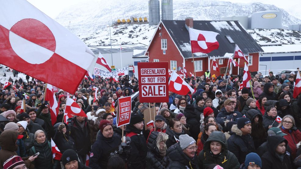 Protesters hold Greenlandic flags and placards outside the US consulate in Nuuk, Greenland, on Jan. 17.