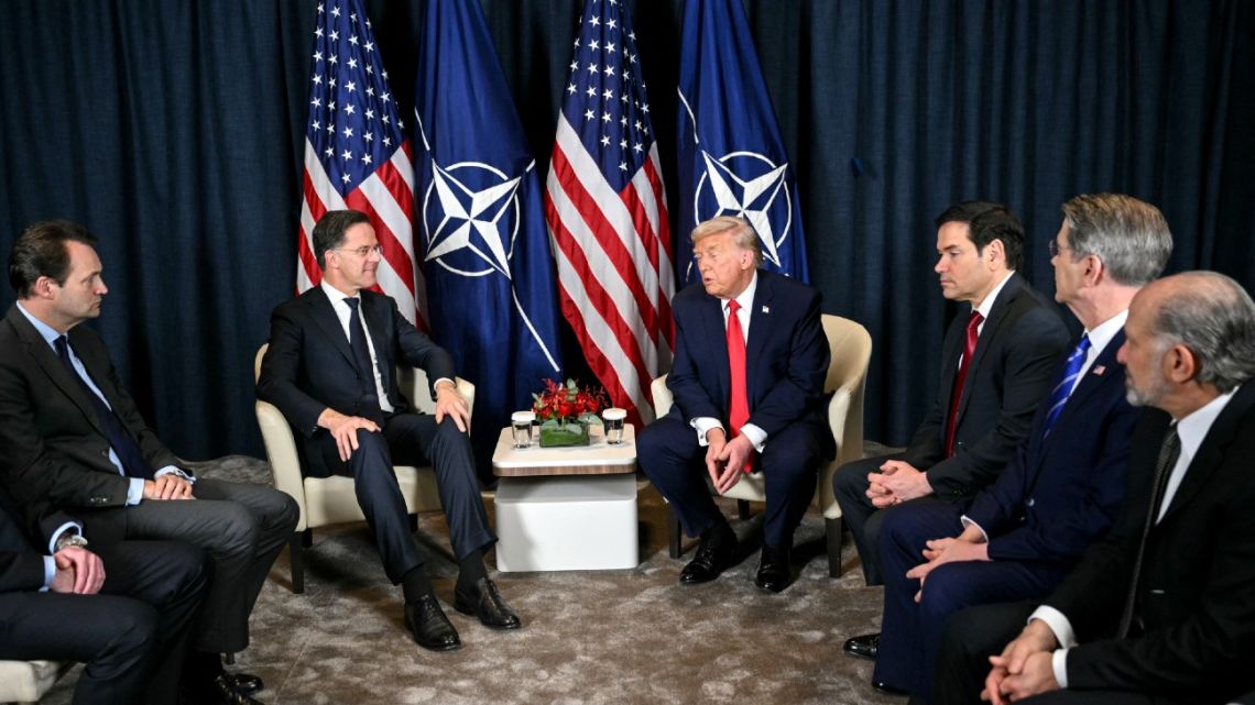 US President Donald Trump (C-R) speaks with NATO’s Secretary-General Mark Rutte (C-L) next to US Secretary of State Marco Rubio (3R), US Secretary of Treasury Scott Bessent (2R) and US Secretary of Commerce Howard Lutnick during a bilateral meeting on …