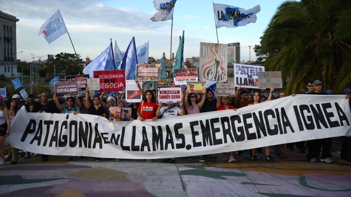 People take part in a protest to demand more help to combat wildfires in Patagonia from Argentina's President Javier Milei government in Buenos Aires on January 30, 2026.