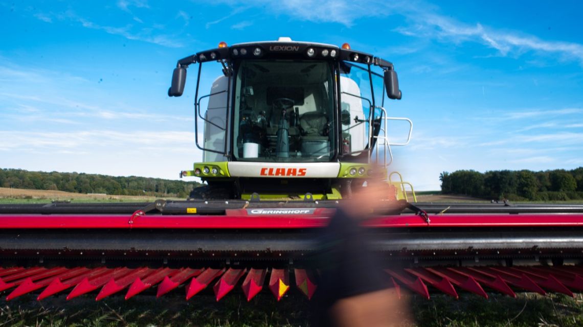 A farmer prepares a combine harvester during a sunflower harvest on a farm in Droizy, France, on Thursday, September 22, 2022.