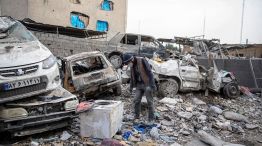 Buildings and vehicles destroyed following airstrikes in Tehran, on March 12.