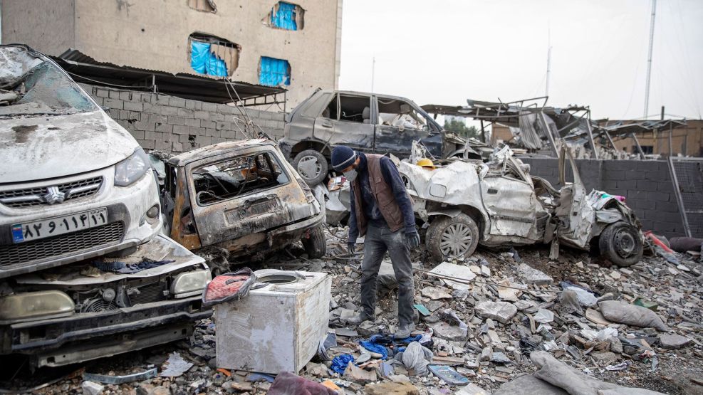 Buildings and vehicles destroyed following airstrikes in Tehran, on March 12.