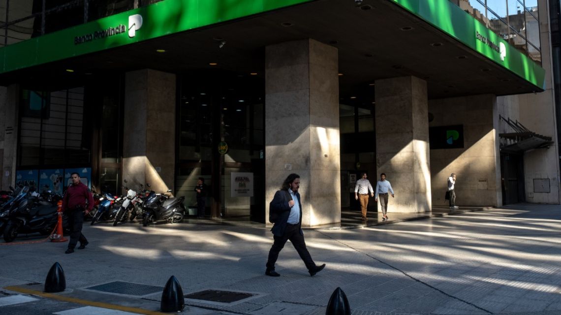Commuters near a Banco Provincia bank branch in the financial district of Buenos Aires.