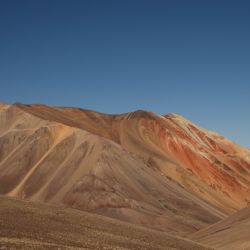 This view shows peaks of the Andes mountain range with a road built for mineral exploration in Calingasta, San Juan province, Argentina, on April 22, 2026. 
