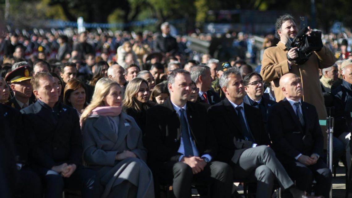 Milei shows support for under-fire Adorni at Flag Day rally