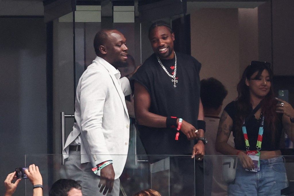 Usain Bolt (izq.) y Noah Lyles (der.) viendo España-Francia.