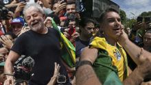 04_10_2026_lula_flavio_bolsonaro_afp_g